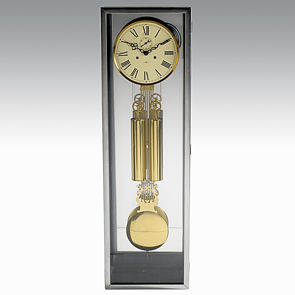 ARTHUR UMANOFF / HOWARD MILLER : ARTHUR UMANOFF / HERMAN MILLER; Case clock, model no. 622, in ebonized wood and chromed steel with white enameled metal face, complete with original brass chiming mechanism and weights; Marked Howard 