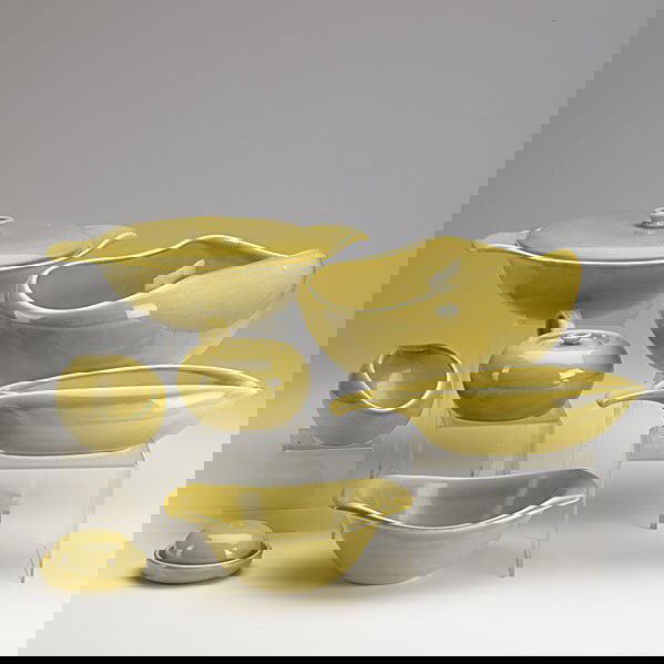 RUSSEL WRIGHT: RUSSEL WRIGHT; Yellow dinneware set includes: (13) 10'' dinner plates, (6) 6'' salad/cake plates, (6) teacups and saucers, (11) expresso cups and saucers, water pitcher, (3) gravy boats, (2) open bowl