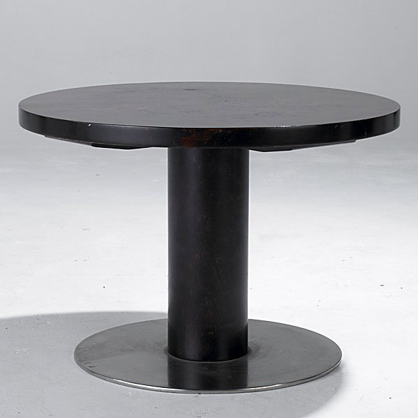 ART DECO: ART DECO; Fine Swedish dark rosewood cocktail table on stainless base; Metal tag, Made in Stockholm; 22'' x 32'' dia.