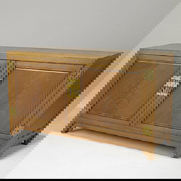 MICHAEL TAYLOR / BAKER: MICHAEL TAYLOR; BAKER; Two door credenza in walnut concealing open storage and two fitted drawers; Metal label; 32'' x 56'' x 19 1/2''