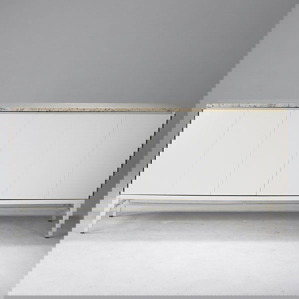 PAUL MCCOBB / IRWIN: PAUL MCCOBB; IRWIN; Credenza with two doors and travertine top; Irwin metal label; 34 1/2'' x 71'' x 19''