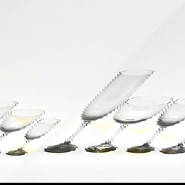 HOLMEGAARD: HOLMEGAARD; Thirty-eight smoke pieces in the ''Elsinore'' pattern include eight champagnes, eight waters, seven wines, eight cognacs and seven cordials; With original paperwork; Tallest: 7''