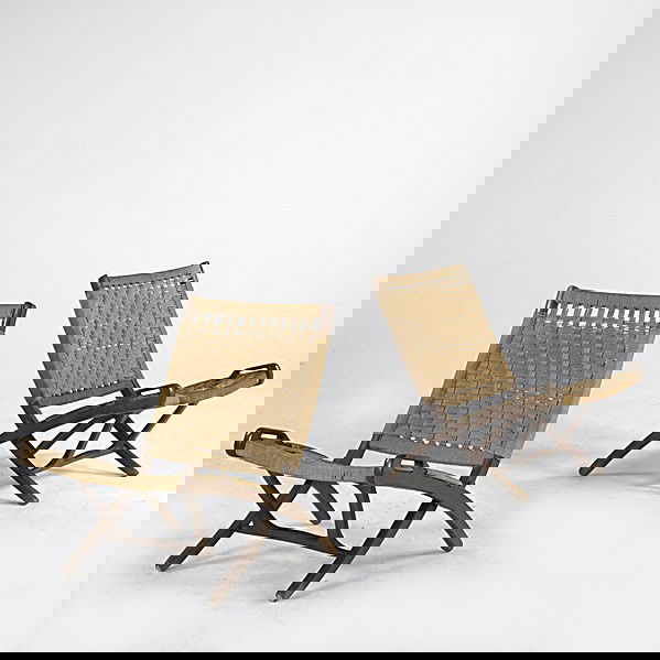 STYLE OF HANS WEGNER: STYLE OF HANS WEGNER; Two folding chairs with woven jute seats on beech frames; 30'' x 23 1/2'' x 31''