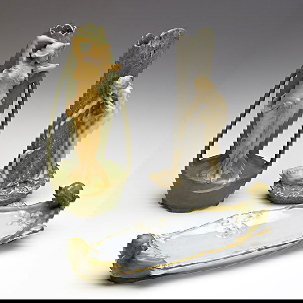 ERNST WAHLISS; Three Amphora porcelain items: ERNST WAHLISS; Three Amphora porcelain items: two vases with maidens, one ring or pen tray; Repair to top of vase with nude and swan and to flower on tray; Vases have red Turn Vienna stamps, 4779 and