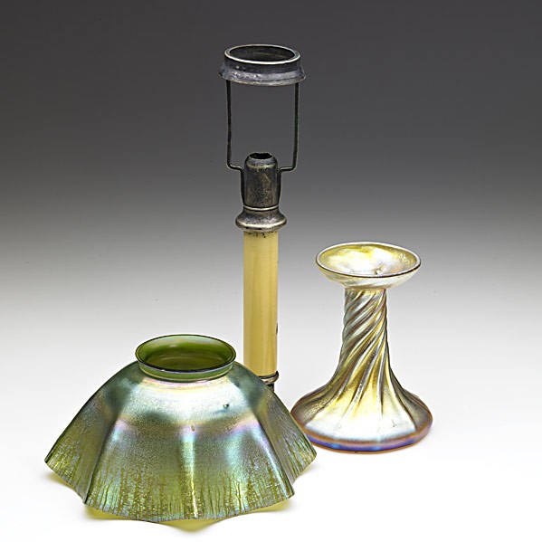 TIFFANY STUDIOS; Three candlestick lamp components: TIFFANY STUDIOS; Three candlestick lamp components: gold Favrile glass candleholder, silver and composite shaft and green Favrile glass shade; Base etched L.C.T., shaft stamped PAT. APR 29 1908, shade