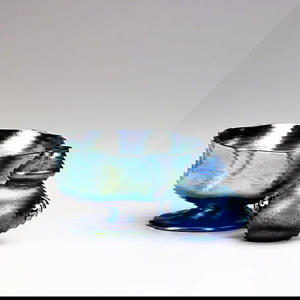 TIFFANY STUDIOS; Two blue Favrile glass vessels: TIFFANY STUDIOS; Two blue Favrile glass vessels: a sherbert and a miniature; Both etched L.C. TIFFANY-FAVRILE, sherbert, 4587E, vase, 10-4906N; 2 3/4'' x 5'' and 2 3/4'' x 2 3/4''