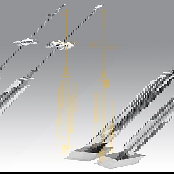 MAISON JANSEN; Fine pair of lamps: MAISON JANSEN; Fine pair of nickel and brass skyscraper-style lamps; Unmarked; 32'' x 6'' sq.