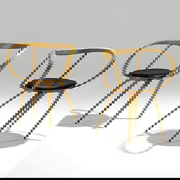 GEORGE NELSON; HERMAN MILLER; Pair of chairs: GEORGE NELSON; HERMAN MILLER; Pair of laminated birch and leather Pretzel chairs (no. 5890); Unmarked; 30 1/2'' x 26'' x 19''