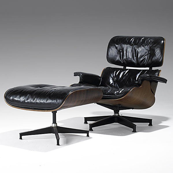 EAMES; HERMAN MILLER; Lounge chair and ottoman: CHARLES AND RAY EAMES; HERMAN MILLER; Rosewood laminate and black leather lounge chair and ottoman (no. 670, 671); Herman Miller tag; Chair: 32 1/2'' x 32 1/2'' x 32 1/2'', ottoman: 17'' x 25 3/4'' x 