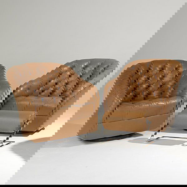 WARD BENNETT; BRICKEL; Pair of club chairs: WARD BENNETT; BRICKEL; Pair of leather and walnut club chairs, single ottoman; Unmarked; Chair: 31'' x 29 1/2'' x 32'', ottoman: 14'' x 20 1/2'' x 9''