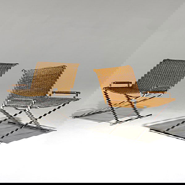 WARD BENNETT (Attr.); Pair of lounge chairs: WARD BENNETT (Attr.); Pair of chromed steel and woven cane lounge chairs; Unmarked; 29'' x 29 1/2'' x 30''
