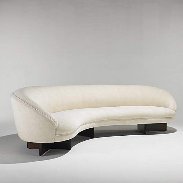 VLADIMIR KAGAN; KAGAN-DREYFUSS; Sofa: VLADIMIR KAGAN; KAGAN-DREYFUSS; Carved walnut and wool curved sofa; Unmarked; 29'' x 112'' x 30''