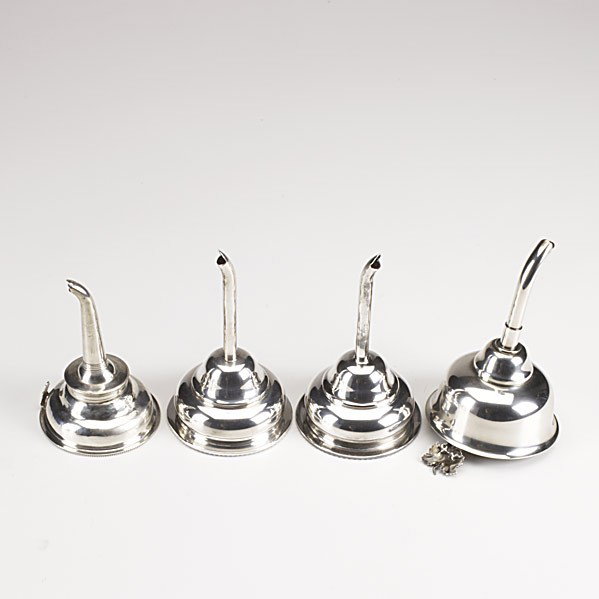 WINE FUNNELS: WINE FUNNELS; Four, 19th/20th c.; One sterling, possibly marked I.C. and lion passant, and three in silver plate; Longest: 5 3/4''