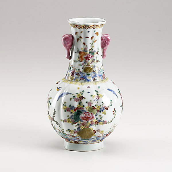 FAMILLE ROSE LOBED VASE: FAMILLE ROSE LOBED VASE; Painted with delicate floral sprays, pink stylized elephant-head handles; Daoguang (1821-1850) mark and of the period; 9 1/2''