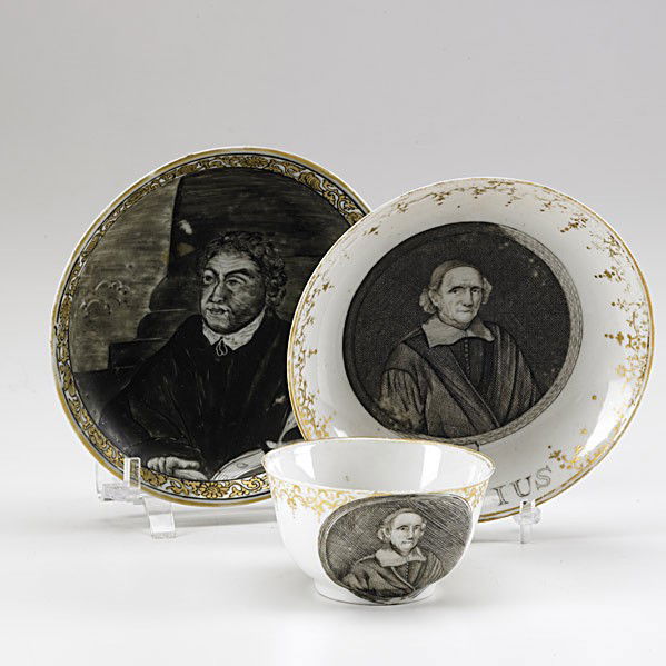 CHINESE EXPORT: CHINESE EXPORT; Teabowl and small saucer depicting John Wesley and the motto ''Voetius'' together with a saucer with a grisaille portrait of Martin Luther, ca. 1740-1750; Largest: 4 5/8''