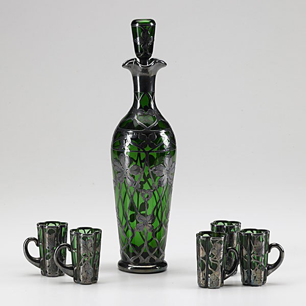 SILVER OVERLAY DECANTER AND CUPS: SILVER OVERLAY DECANTER AND CUPS; Six pieces in green glass, early 20th c.; Silver marked for George Henckes & Co., New York; Decanter: 12''