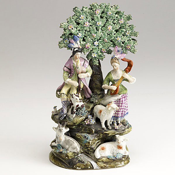 ENGLISH PEARLWARE: ENGLISH PEARLWARE; Pair of musician figurines, shepherd and companion seated on a rock with animals, ca. 1825; 10 1/2''