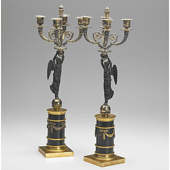 PAIR OF BRONZE CANDELABRA: PAIR OF BRONZE CANDELABRA; Patinated Winged Victory figures with dore decoration, 20th c.; 20 1/2''