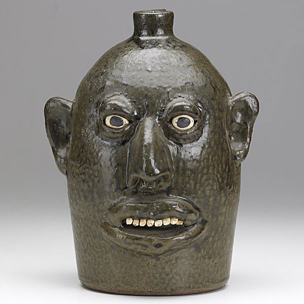 LANIER MEADERS: LANIER MEADERS; Glazed stoneware face jug with clay teeth and eyes; Signed; 10 1/4'' x 7 3/4''