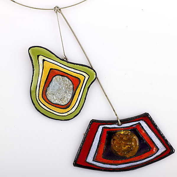 PIERRE CARDIN COUTURE FUSED GLASS PENDANTS: PIERRE CARDIN COUTURE FUSED GLASS PENDANTS Two boldly colored enamel and fused glass pendants with torque, ca. 1970. Each signed P. Cardin, Paris. One tag PF.49 decor A.103; Largest: 5''