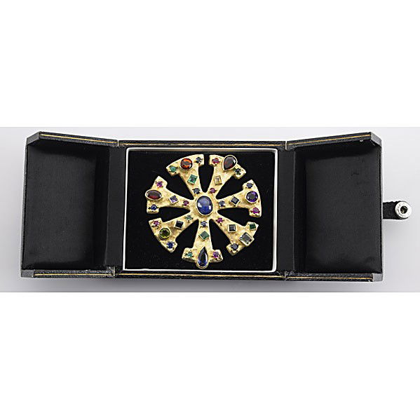 ED WEINER GEM-SET PENDANT/BROOCH: ED WIENER GEM-SET 18K PENDANT/BROOCH ca. 1973 Textured open disk with mixed cut sapphires, emeralds, colorful semi-precious gems. 50.5 gs., 2 3/8''. Marked