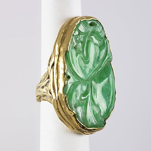 ED WEINER CHINESE JADE 18K RING: ED WIENER CHINESE JADE 18k RING Large foliate carved jade panel in heavy freeform mount, ca. 1962. Unsigned. 39.3 gs., size 6 1/2, 1 5/8''. Note: Authenticated by estate of the artist. Similar example