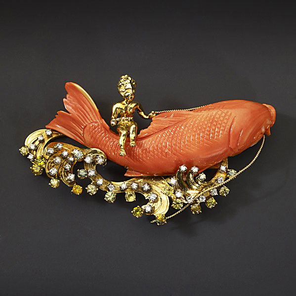 CARVED CORAL & GEM-SET 18K GOLD BROOCH: CARVED CORAL GEM-SET 18K GOLD BROOCH After Ruser, a gold nymph rides a leaping carp among gold waves and seafoam of peridots and diamonds, approx. 1 cts. TW. 43 gs. 2'' x 3 1/8''