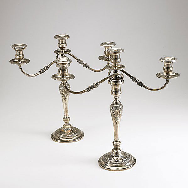 PAIR OF SILVER CANDELABRA: PAIR OF SILVER CANDELABRA By Frank M. Whiting & Co. ca. 1930. Three light on removable reed branch, baluster column and flared foot with floral and garland repousse, weighted column, open foot. Some r