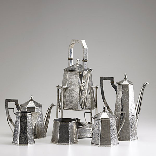 BIXBY SILVER CO. COFFEE SERVICE: BIXBY SILVER CO. COFFEE SERVICE Providence, R.I., 1896-1909. Six pieces, tapered octagonal forms and faceted handles, profuse bright cut decorations. Gothic monogram ''I''. 16 1/2'' kettle on stand, 1