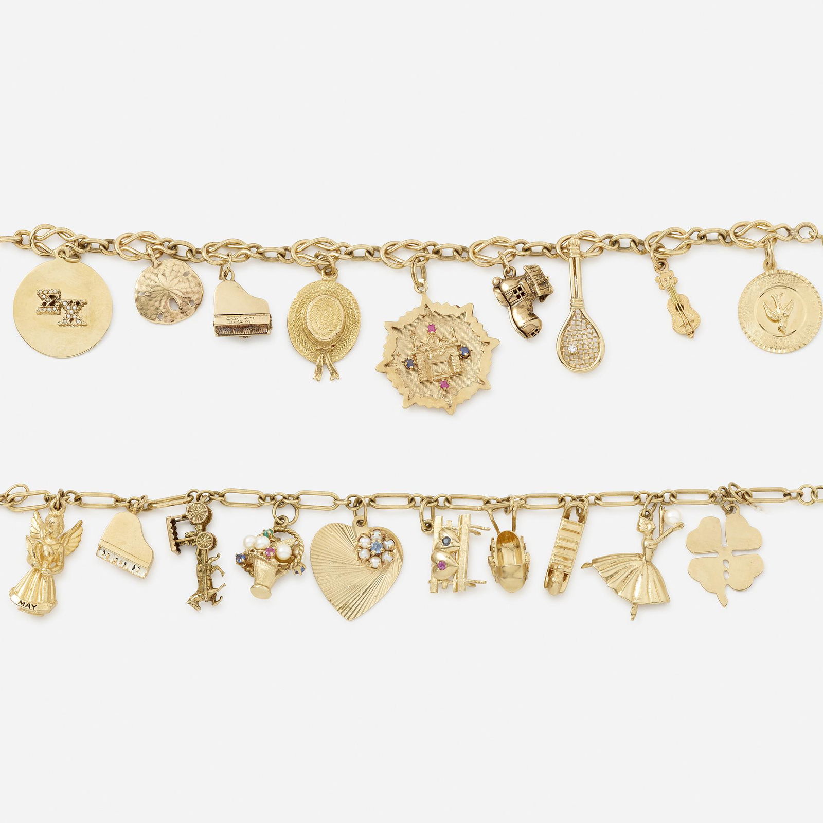 Two gold charm bracelets: Two gold charm bracelets One comprising ten charms, including an angel, clover, and carriage; the other comprising nine charms, including a sand dollar, tennis racket, and piano 14k yellow gold 8 x 0.