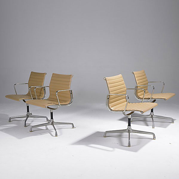 CHARLES & RAY EAMES / HERMAN MILLER: CHARLES & RAY EAMES; HERMAN MILLER; Set of four Soft Pad arm chairs; Each chair embossed with fabric label; 33'' x 22 1/2'' x 22''