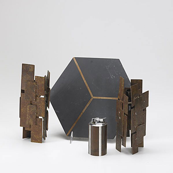 PAUL EVANS AND PHILLIP POWELL: PAUL EVANS AND PHILLIP POWELL; Rosewood and pewter lighter and slate and walnut trivet together with stylized bronze candlesticks; Lighter 4 1/4'' x 2''