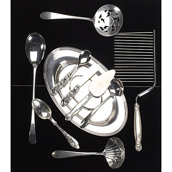 STERLING AND SILVERPLATE: STERLING AND SILVERPLATE; Thirty pieces: Handwrought ML-01 Mexico ladle with blossom design handle, eleven-piece fruit design condiment utensils, cake comb, Buccelatti sterling small serving spoon; 7.