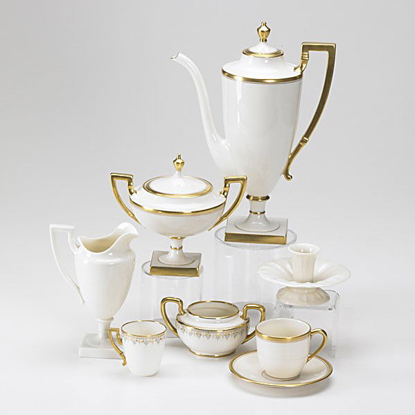 LENOX / TIFFANY & CO.: LENOX; TIFFANY & CO.; Fifty-four pieces in various patterns, 20th c.; Tea service for eight, chocolate set for eight, six Art Deco-style teacups, saucers with matching creamer and pair of floriform ca