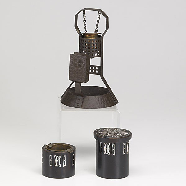 GERMAN ARTS & CRAFTS SMOKING ACESSORIES: GERMAN ARTS & CRAFTS SMOKING ACESSORIES; Three pieces forged iron combination hanging oil lighter, cigarette box, ashtray, laquered wood with matching ashtray, both with mother of pearl inlay; Tallest