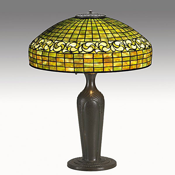 TIFFANY STUDIOS: TIFFANY STUDIOS; Bronze and leaded glass table lamp, shade in lemon leaf pattern, base in papyrus pattern; Base stamped TIFFANY STUDIOS NEW YORK 627, shade is signed and numbered 1470; 24'' x 18''