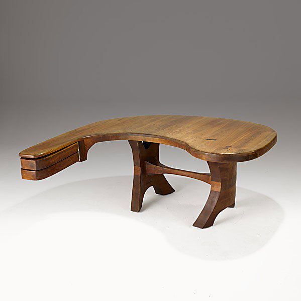 STUDIO: STUDIO; Stacked and carved walnut, brass and rosewood desk, 1960's; Unmarked; 29 1/2'' x 67'' x 65''