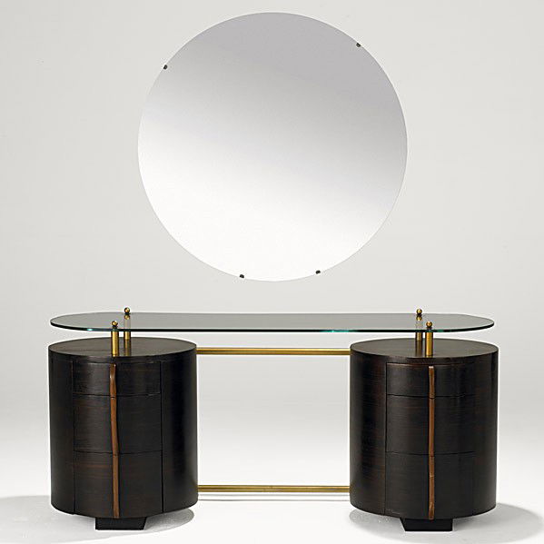 GILBERT ROHDE; HERMAN MILLER: GILBERT ROHDE; HERMAN MILLER; Macassar ebony, maple, glass and brass double pedestal vanity, 1940's; Foil label; 26 1/2'' x 58'' x 21 1/2'', mirror dia. 35''