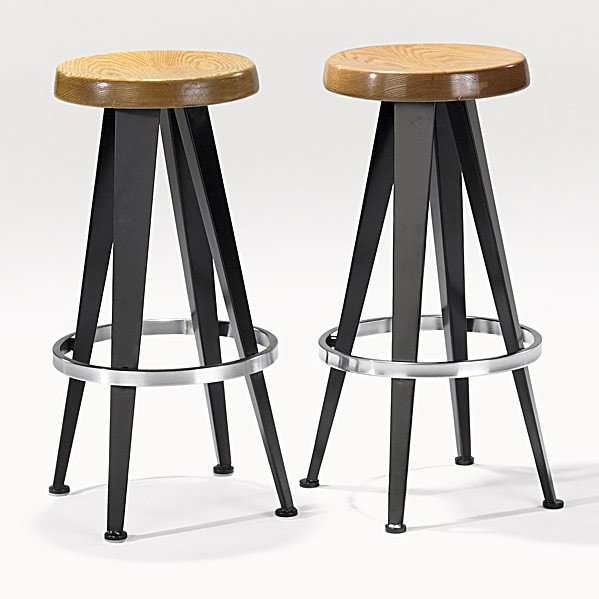 AFTER JEAN PROUVE: AFTER JEAN PROUVE; Pair of bar stools with oak tops over patinated and brushed steel bases, 1989-90; Commissioned for West Broadway restaurant, New York; Unmarked; 28'' x 14''