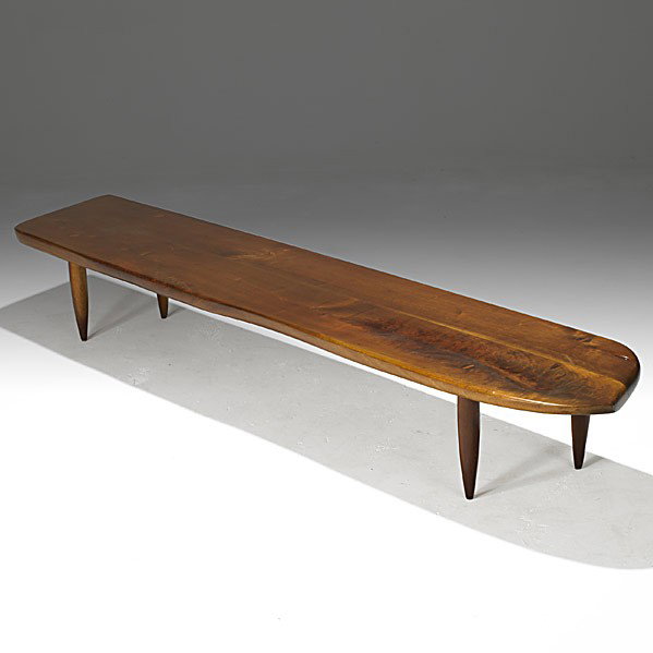 PHIL POWELL: PHIL POWELL; Fine sculpted walnut cocktail table, 1960's; Unmarked; 12'' x 86'' x 17''