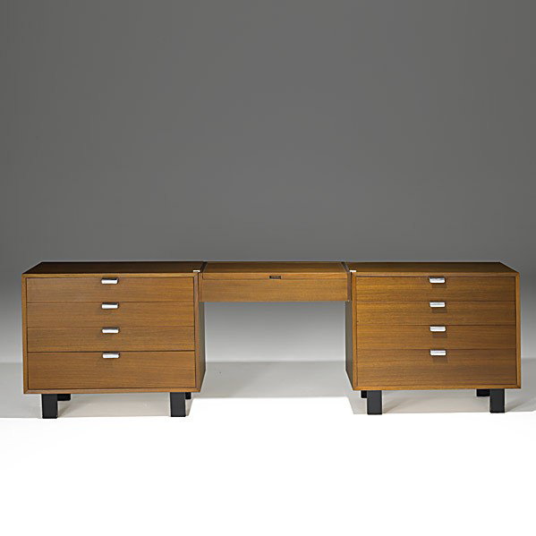 GEORGE NELSON; HERMAN MILLER: GEORGE NELSON; HERMAN MILLER; Two walnut dressers with hanging vanity, zinc plated handles; Foil labels; Tall dresser: 45 3/4'' x 34'' x 19 1/2'', shorter: 30'' x 34'' x 19 1/2'', vanity: 6'' x 30'' x
