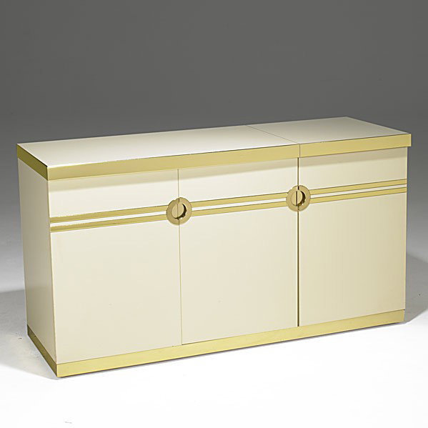 PIERRE CARDIN: PIERRE CARDIN; Laminate and brass bar cabinet; Carved signature; 30 1/2'' x 55 3/4'' x 20''