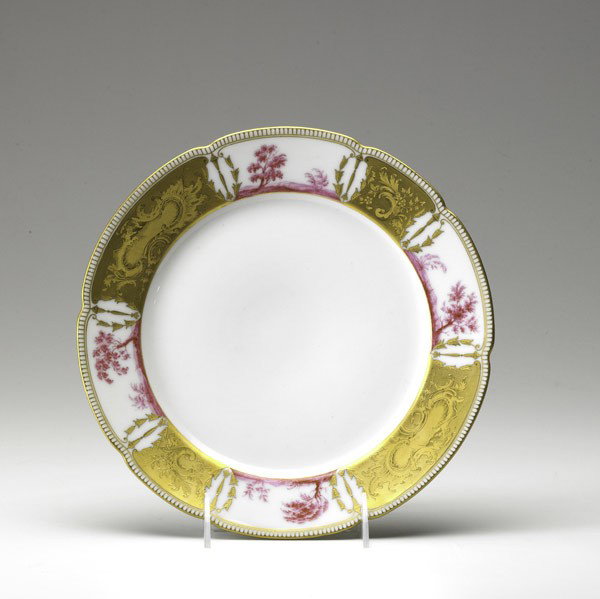 IMPERIAL RUSSIAN PORCELAIN: IMPERIAL RUSSIAN PORCELAIN; ''Purple'' service dinner plate from the reign of Tsar Nicholas II with gilt and landscape design border, 1905; Marked for Nicholas II; 10'' dia.