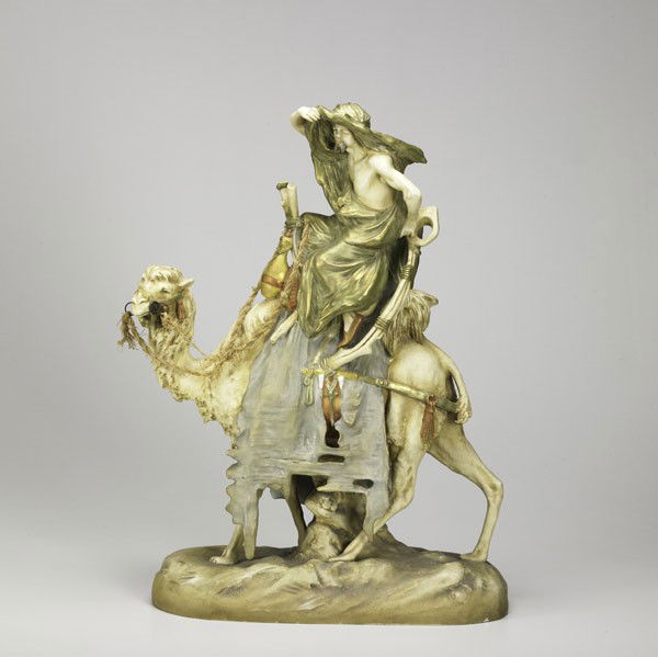 AMPHORA: AMPHORA; Figure of a desert nomad on camel, 20th c.; Marked Amphora Austria; 14'' x 20 1/2'' x 7''