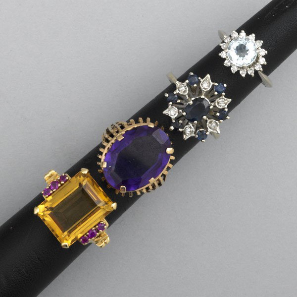 COCKTAIL RINGS: COCKTAIL RINGS, ca. 1940-1965. Four rings: aquamarine and diamond in 14k wg, size 5; 14k wg sapphire and diamond, size 6 1/2; 14k yg citrine and ruby, size 6 1/2; synthetic alexandrite in 14k yg, size