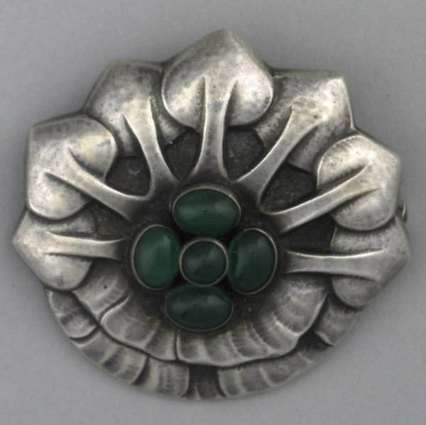 GEORG JENSEN SILVER AND CHRYSOPRASE BROOCH: GEORG JENSEN SILVER AND CHRYSOPRASE BROOCH. Floriform with chrysoprase cluster, #64. George Jensen, Denmark, 1933-1944. 14.5 gs. GW, 1 3/4''