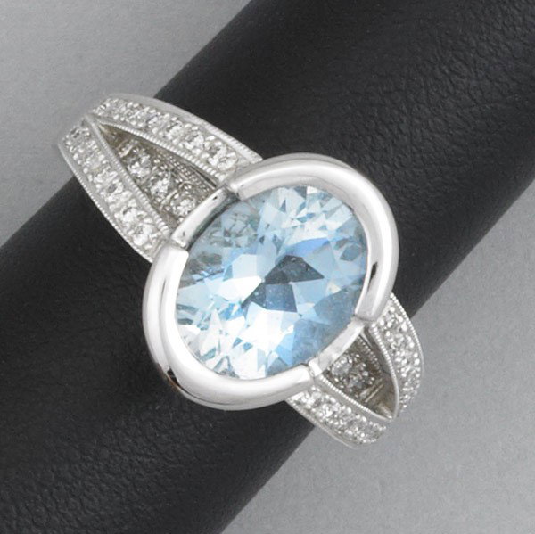 AQUAMARINE AND DIAMOND CONTEMPORARY RING: AQUAMARINE AND DIAMOND CONTEMPORARY RING. 3 cts. aqua and .75 ct. TW diamonds in 18k wg ''split-shank'' openwork basket. 9.2 gs. GW, size 6 1/2