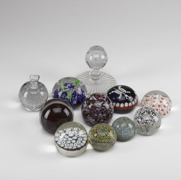 ART GLASS: ART GLASS; Twenty-six pieces: twenty-three paperweights (Maude and Bob, Wheaton Village, etc.), large perfume with brass dauber, vase with internal orchid decoration and paperweight vase; Tallest: 9''