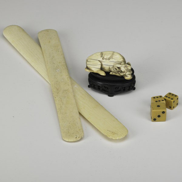 IVORY: IVORY; Bison Netsuke, signed together with two page turners and three dice; 7''