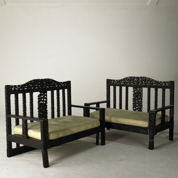 ASIAN FURNITURE: ASIAN FURNITURE; Pair of ebonized settees assembled from an opium bed, c. 1900; Each: 41 1/2'' x 53 1/2'' x 29''
